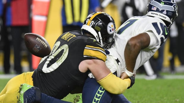 Pittsburgh Steelers LB T.J. Watt tackles Seattle Seahawks QB Geno Smith